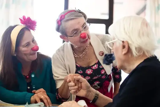 Elderflowers holding hands and sharing a warm connection with an elderly resident
